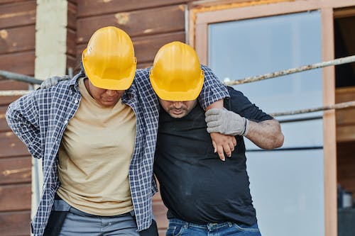 Worker Supporting an Injured Co-Worker